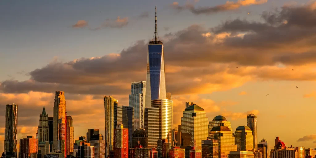 New York City skyline featuring One World Trade Center at sunset